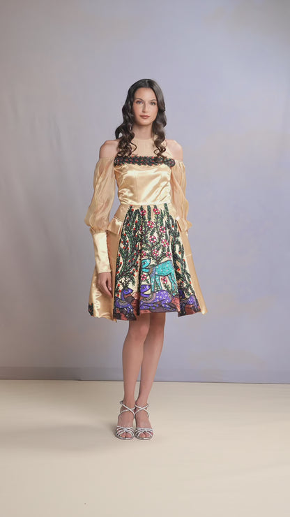 Model walking in Morning Light short dress with gold satin bodice and vibrant skirt