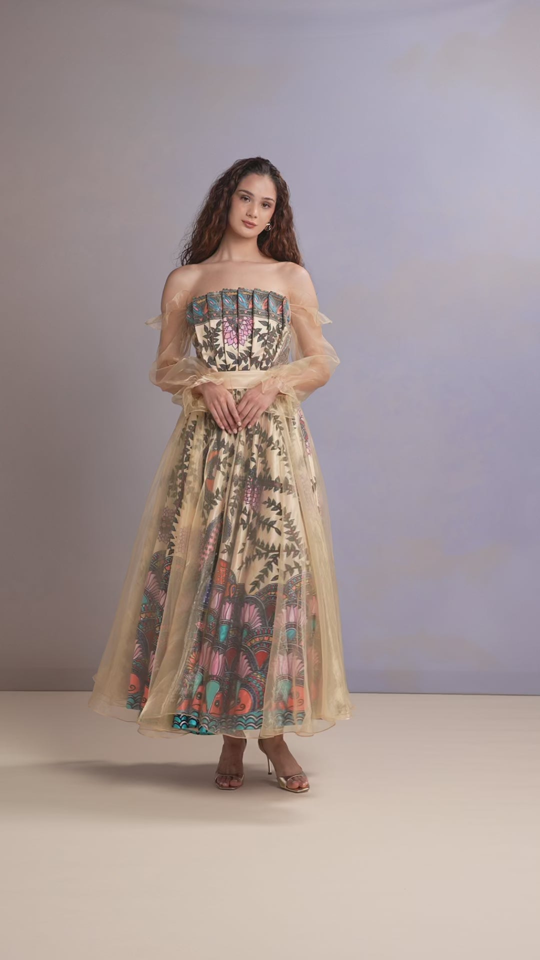 Video of yellow floral dress in motion showcasing flare and fabric texture