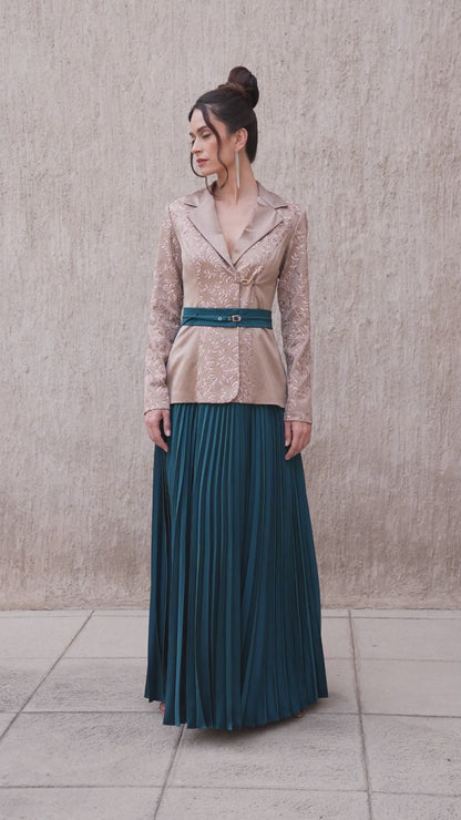 Model walking in brown oak blazer and moonlight blue pleated skirt