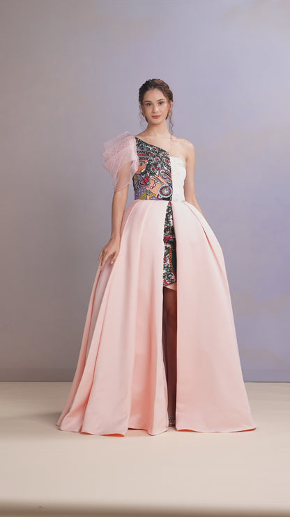Women walking in coral blush silk satin gown with floral bodice and flowing skirt